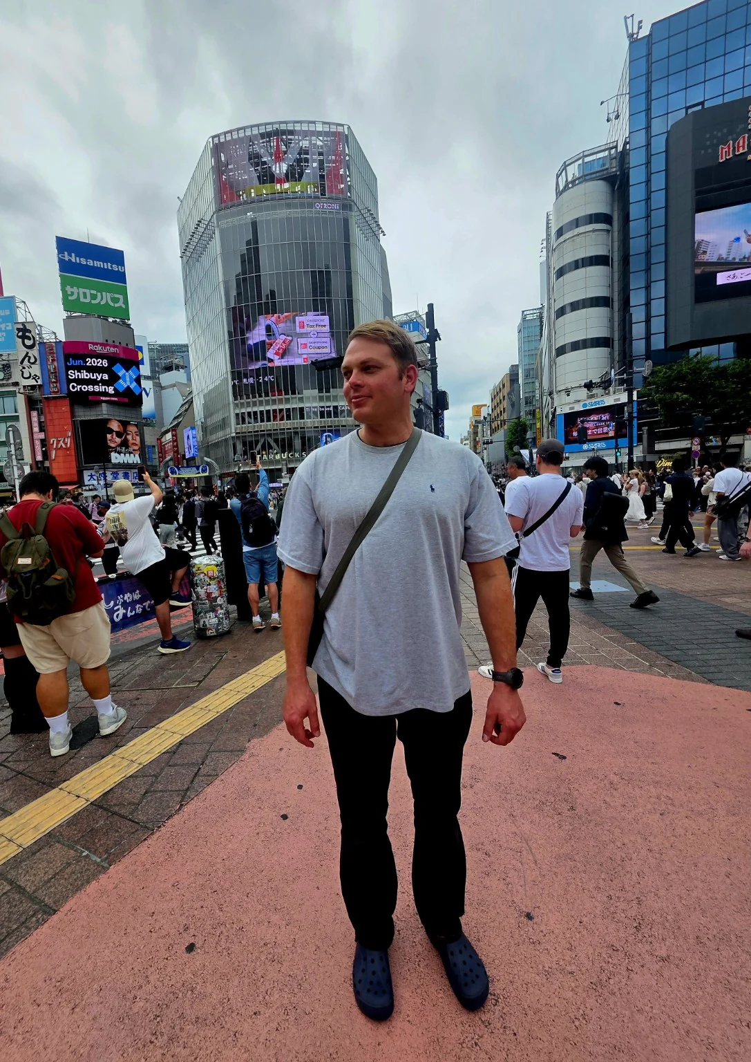 Reilly standing at Shibuya Crossing in Tokyo